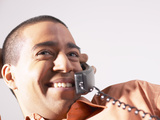 Smiling Man Talking on Telephone