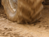 Tire Churning Through Mud