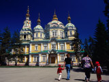 Family Walking Outside Zenkov Cathedral in Panfilov Park  Almaty  Kazakhstan