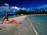 Woman Sunbathing on Sand Spit of Snick Island  El Nido  Philippines