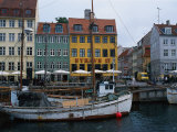 Boats in Canal by Buildings  Copenhagen  Denmark