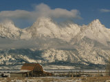 A View of the Mormon Row Barn and the Grand Tetons Behind