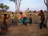 Boys Practising Rodeo Skills on 44 Gallon Drum  Kimberley  Western Australia  Australia