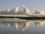 A Puffy Cloud over a Calm Waterway