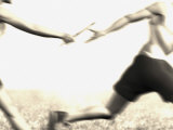 Relay Racers Handing Off the Baton