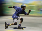 Teen Boy Rollerblading Quickly