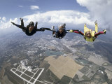 Skydivers Joining Hands