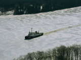 A US Coast Guard Boat Breaks its Way Through the Icy River