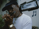 Portrait of a Man Playing a Harmonica