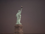 Rear View of the Statue of Liberty against a Dark Sky