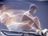 Man Using Rowing Machine