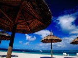 Thatched Umbrellas on an Beach  Trou d'Eau Douce  Mauritius