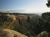 A Man Atop Red Rock Canyon Overlook in Colorado National Monument