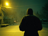 A Winter View of a Man Standing in a Street