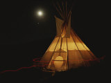 A Tepee is Illuminated against the Night Sky