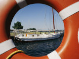 An Orange Life Preserver Frames a Sailboat at the Museum