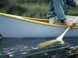 Close View of a Person Paddling a Canoe