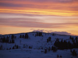 Sunset Sky over Snowy Hills Cast in Shadow