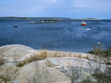 A Lobster Boat Sits at Anchor in a Bay in Maine on an Autumn Day