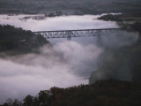 A Railroad Bridge Crosses a Fog-Bound River