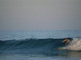 A Woman Surfing in Baja California
