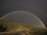 A Rainbow Arches over the Alaska Highway in British Columbia  Canada