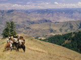 A Group of Horseback-Riding Tourists Take in the View of Hells Canyon