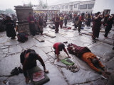 Buddhist Pilgrims Outside Jokhang Temple in Lhasa  Tibet