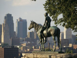 The Scout  a Statue of a Native American and a Horse  Overlooks a City