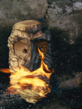 A Wooden Mask is Set on Fire