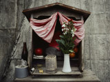 Close View of a Shrine with Offerings of Tangerines and an Apple
