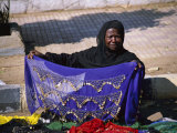 A Nubian Woman Sells Colorful Scarves on the Street
