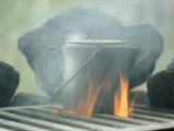 Coffee Pot Steaming over a Campfire