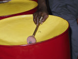 An Island Musician Plays a Brightly Colored Set of Steel Drums