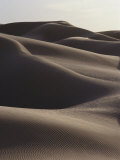 Several Sand Dunes Appear to Rise Like Giant Waves