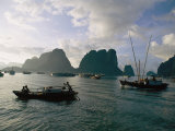 Sampans Ply the Placid Waters of Halong Bay