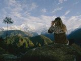 Woman with Binoculars Near the Annapurna Range  Nepal