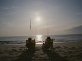 Fishermen in Beach Chairs Wait for a Bite Along the Ocean Shore