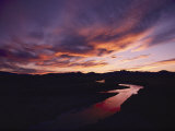 A Gorgeous Purple and Gold Sunset Tints Windswept Clouds and the Sweetwater River