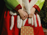 A Woman in a Fur Stole Holding a Purse