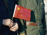 A Pair of Hands Holds the National Flag of China