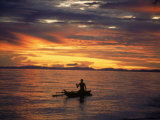 Native Fisherman in Outrigger Canoe  Indonesia