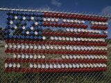 A Makeshift American Flag of Plastic Cups Decorates a Fence
