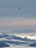 A Twin Otter Flies over Calley Glacier on the Antarctic Peninsula