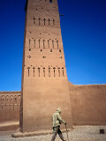 Man Walking Past Minaret  Part of Oulad Driss Kasbah  Near M'Hamid  M'Hamid  Morocco