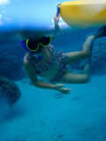 Girl Snorkelling While Holding onto Canoe  Cook Islands