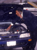 Businessman on Cell Phone Having Car Trouble