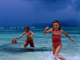 Children Running Out of Ocean in Stormy Weather  Seychelles