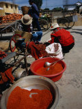Women from Small Patou Island Grind Chilies to Powder  Dali  Yunnan  China