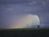 A Farmer Irrigating His Fields